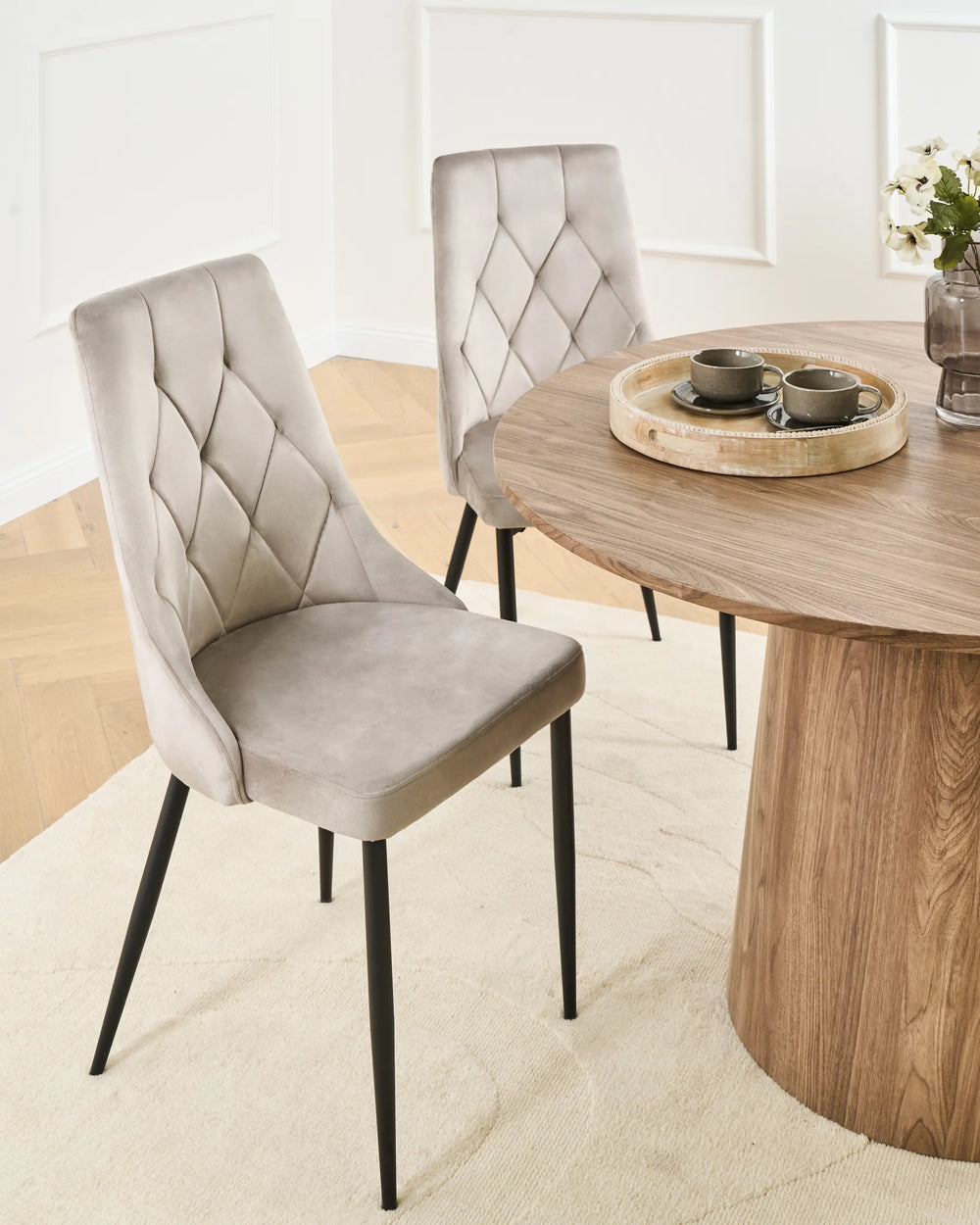 Elegant dining space featuring modern velvet chairs that add softness, comfort, and contemporary style.
