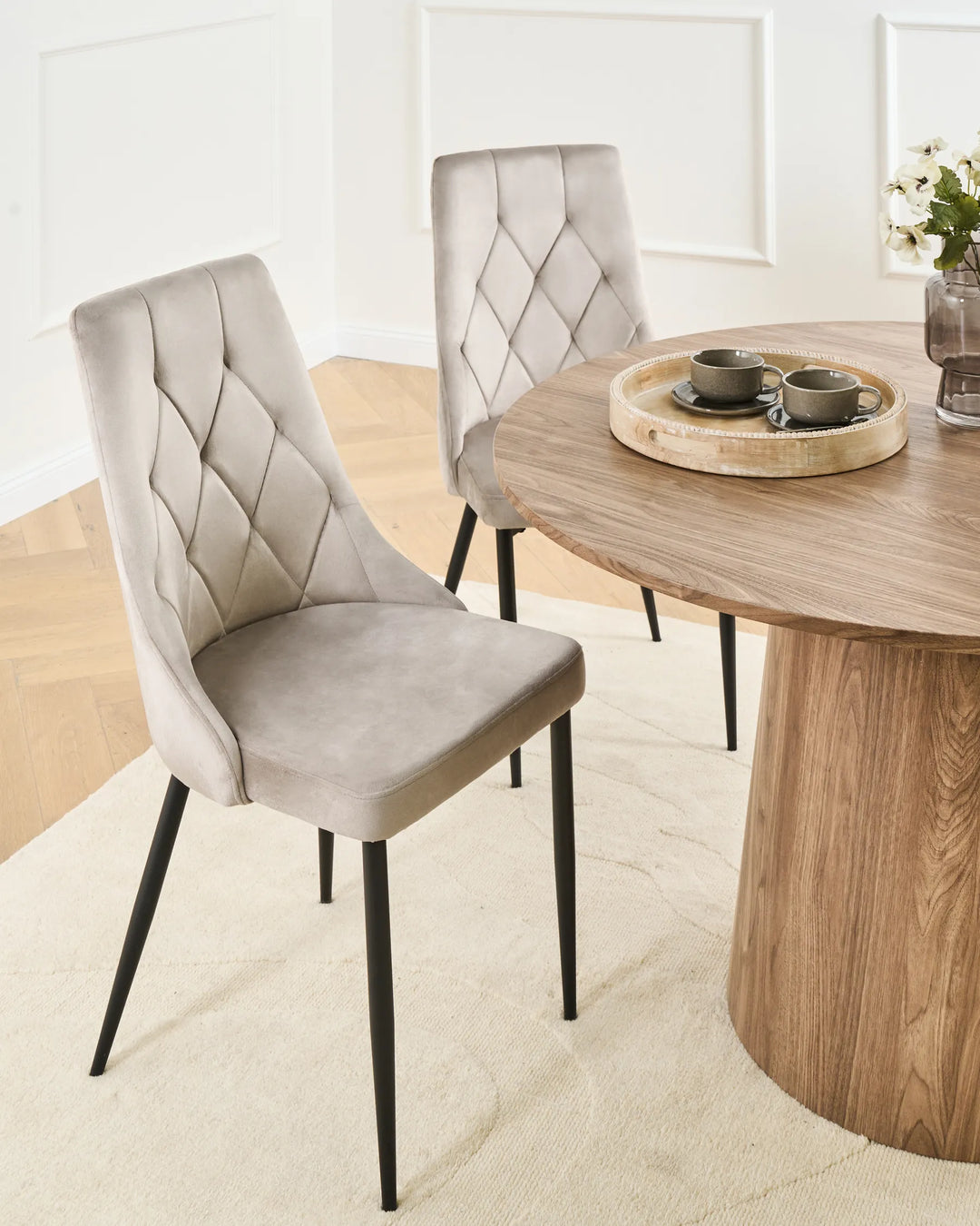 Elegant dining space featuring modern velvet chairs that add softness, comfort, and contemporary style.