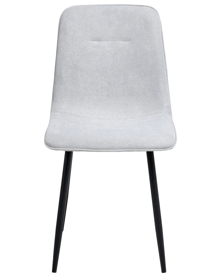 Light grey upholstered dining chair with a clean, minimalist silhouette, cushioned seat, and slim black metal legs.