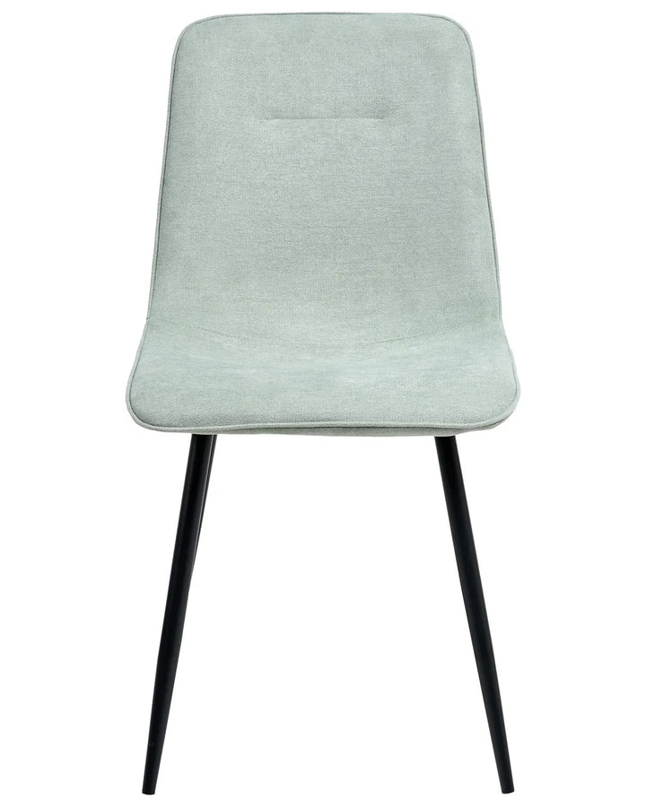 Light green upholstered dining chair with a slim silhouette, padded seat and backrest, and sleek black metal legs.
