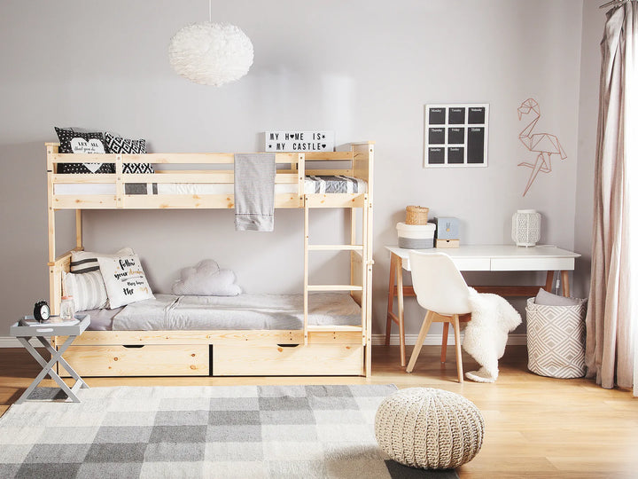 Children's bedroom with a bunk bed, desk, and decorative items.