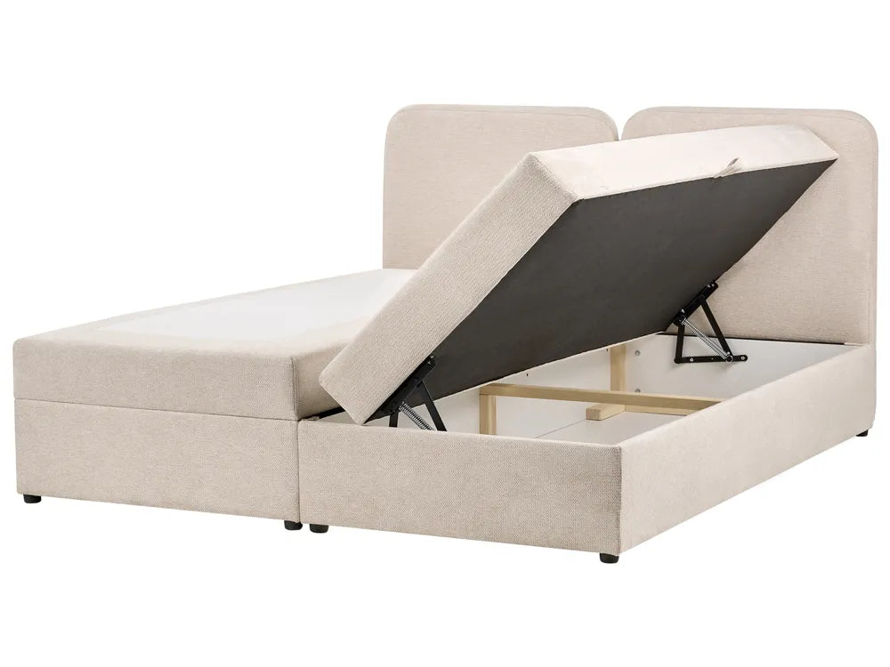 Beige upholstered bed with storage compartment on a white background