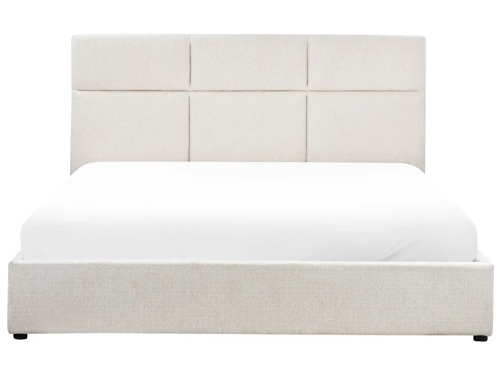 White upholstered bed with a headboard on a white background