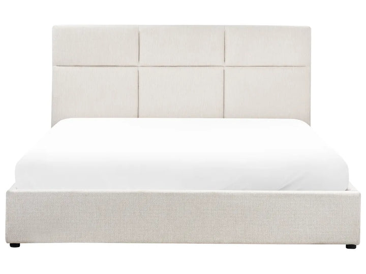 White upholstered bed with a headboard on a white background
