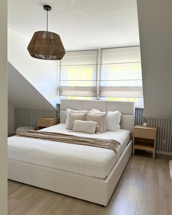 Modern bedroom with a large bed, wooden nightstands, and a pendant light.