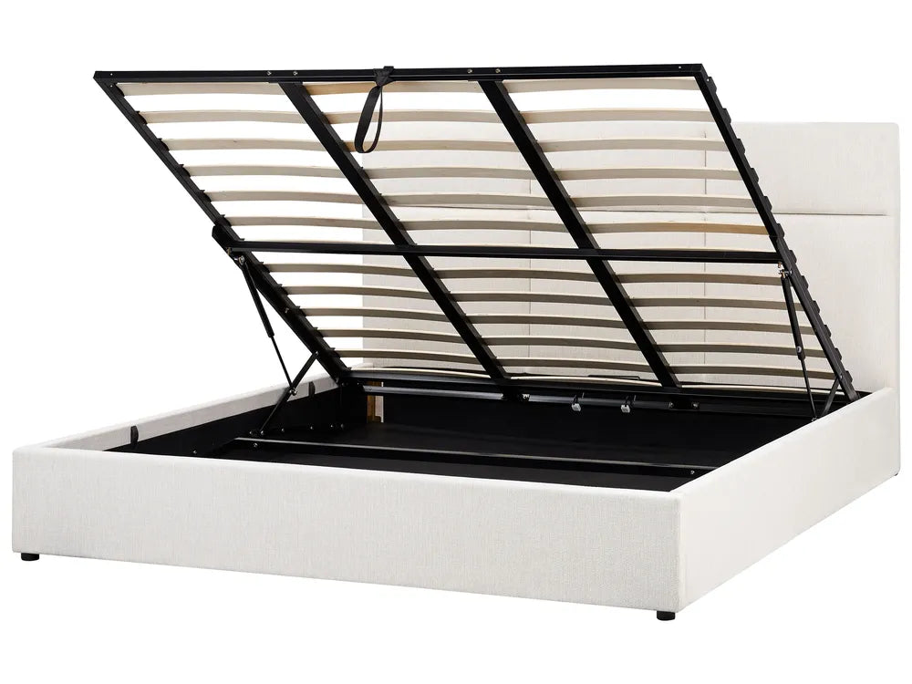 White bed frame with black metal headboard on a white background