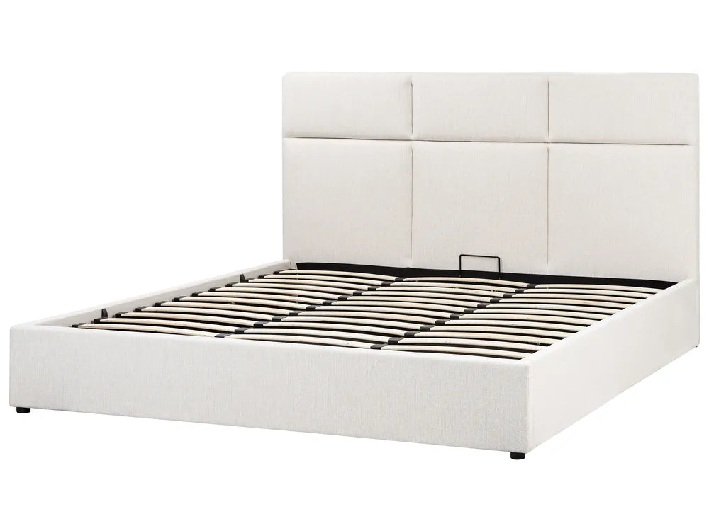 White upholstered bed frame with a quilted headboard on a white background