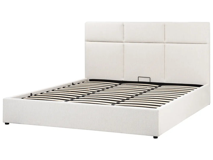 White upholstered bed frame with a quilted headboard on a white background