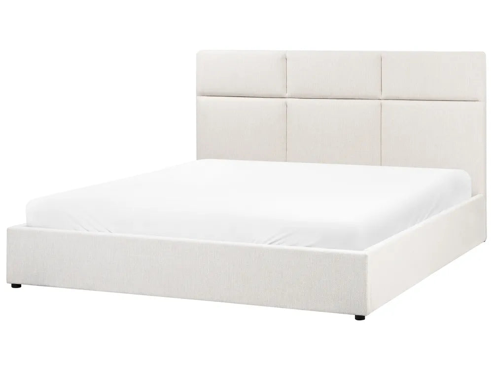 White upholstered bed with a headboard on a white background