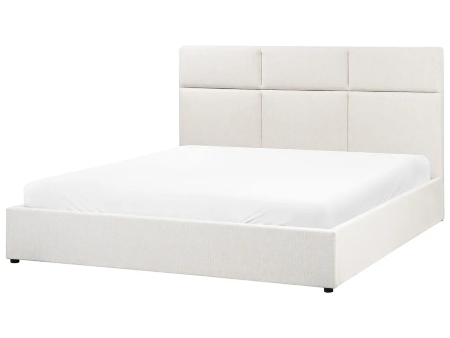 White upholstered bed with a headboard on a white background