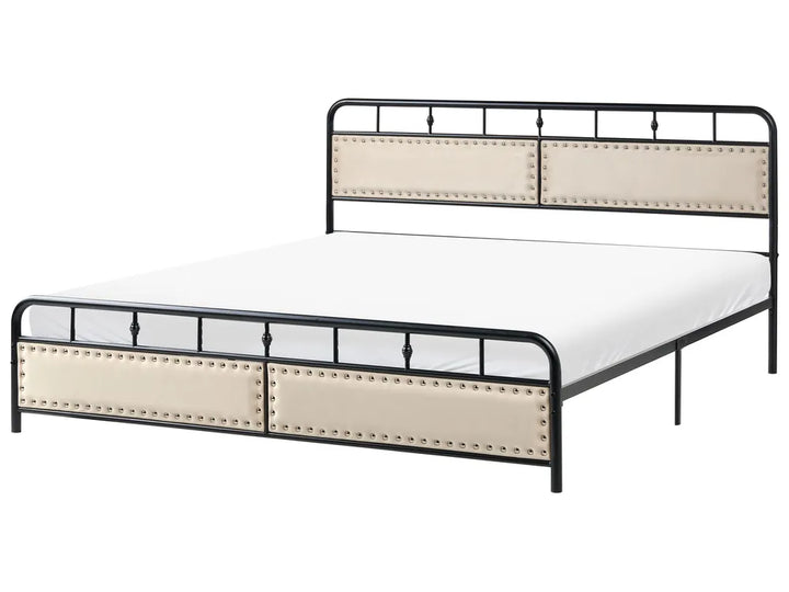 Black metal bed with upholstered panels and rivets