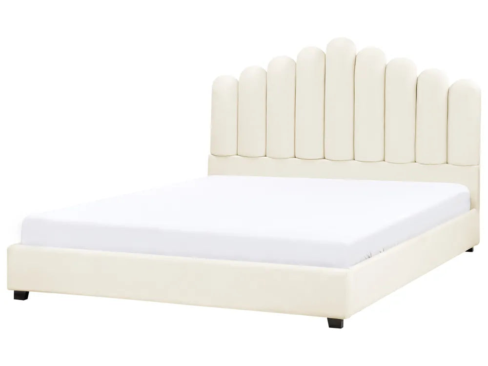 Beige upholstered bed with a white mattress on a white background