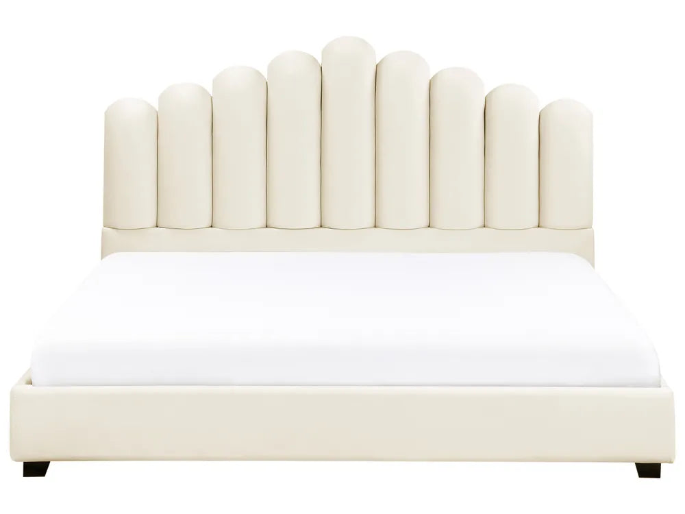 Beige upholstered bed with a white mattress on a white background