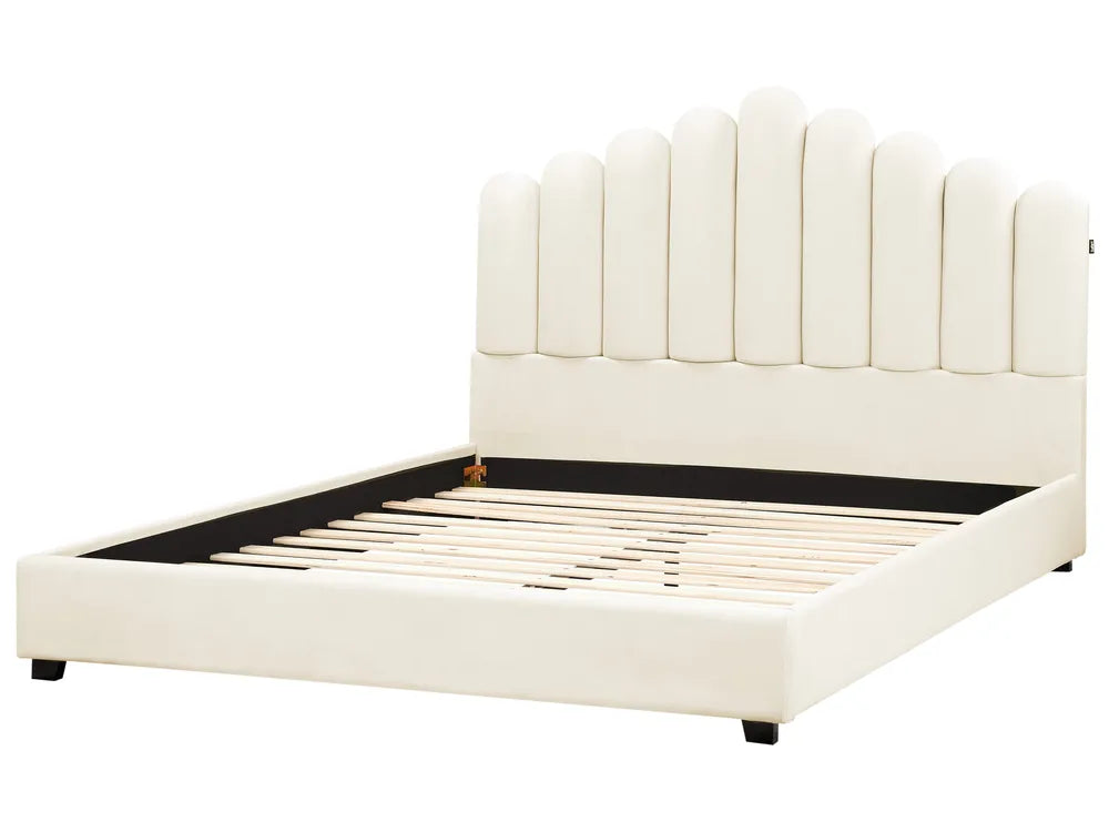 White upholstered bed with a tufted headboard on a white background