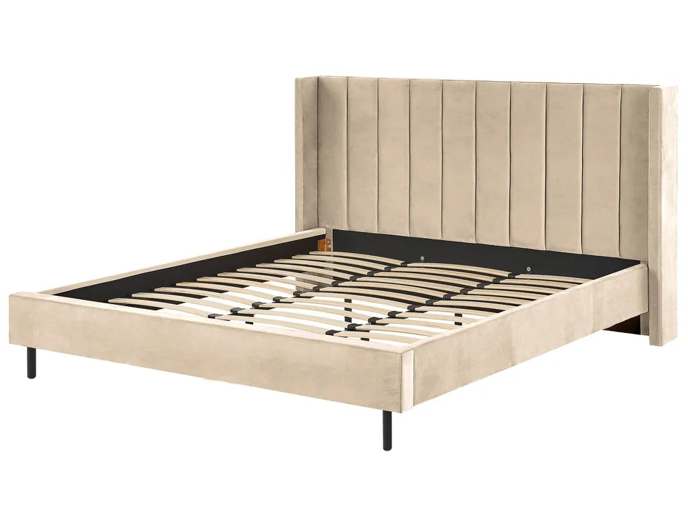 Beige upholstered bed frame with metal slats on a white background