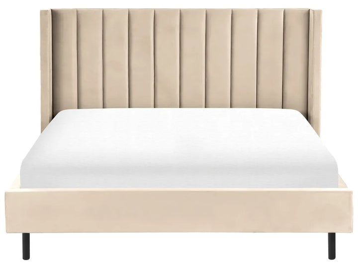 Beige upholstered bed with white mattress on a white background