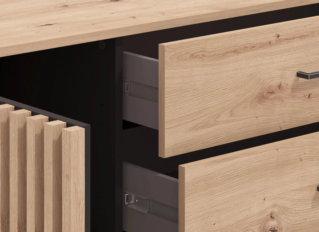 Wooden furniture with open drawers and a light wood finish.