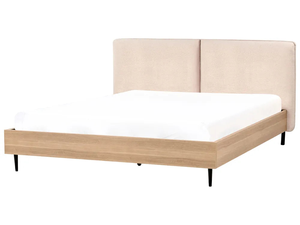 Bed with wooden frame and beige upholstered headboard on a white background