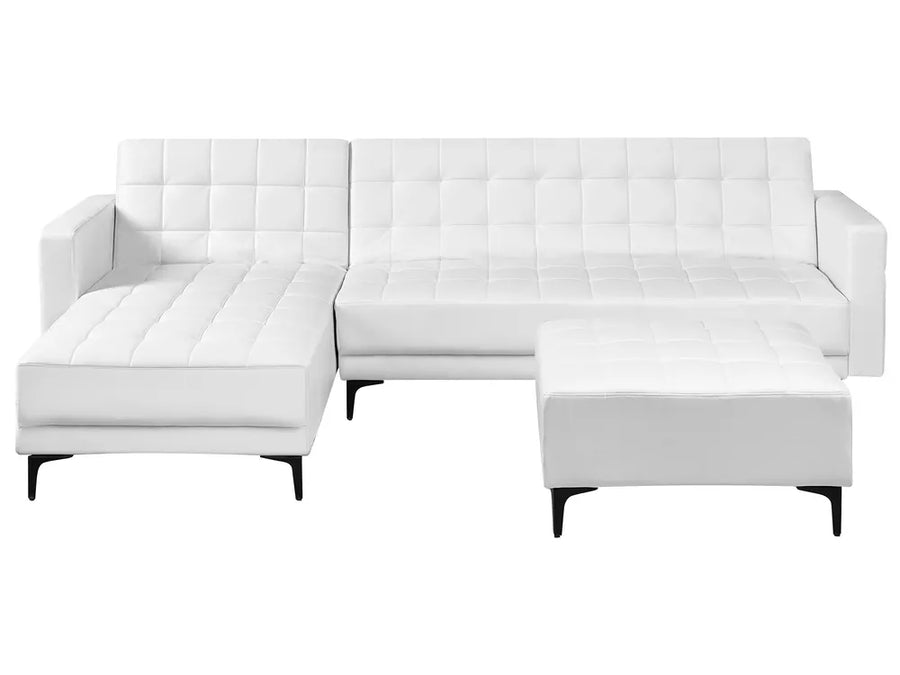 White sectional sofa with ottoman on a white background