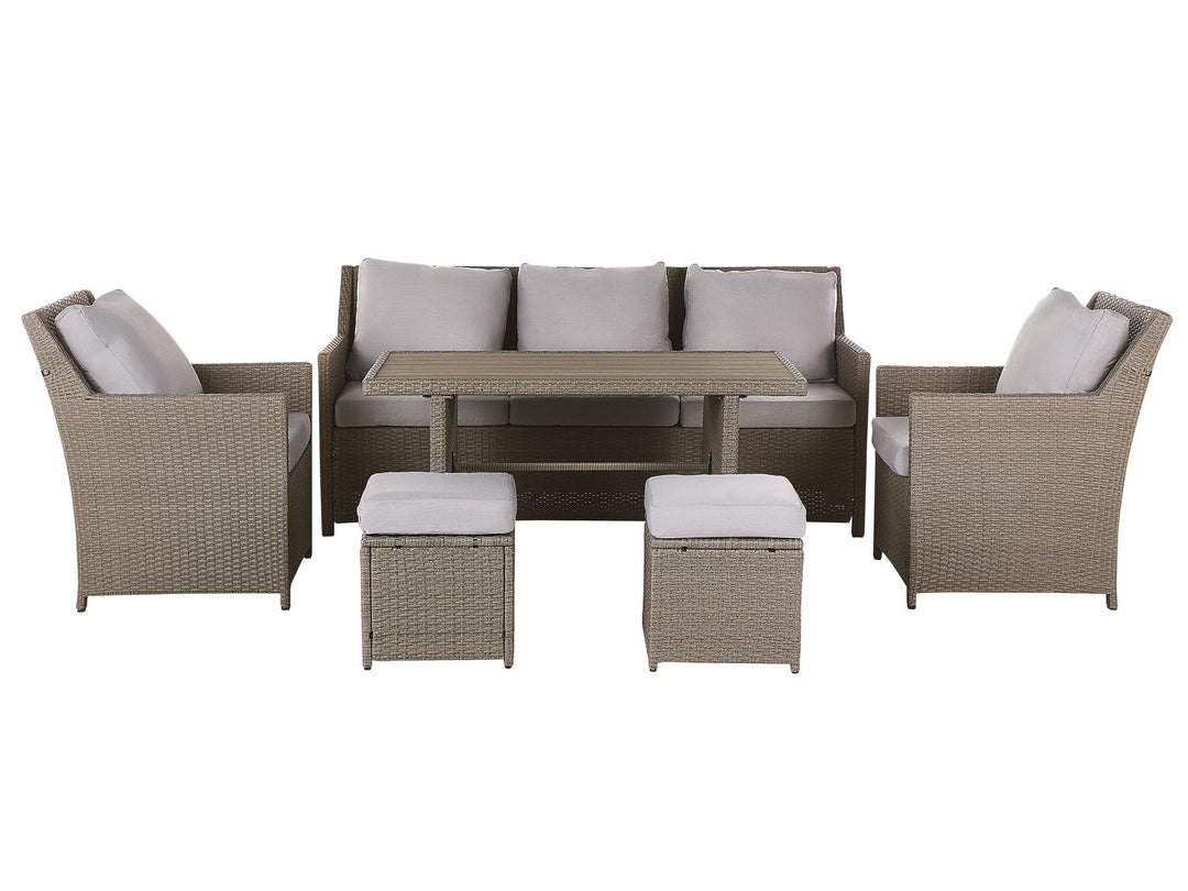 Outdoor furniture set with chairs, table, and ottomans on a white background