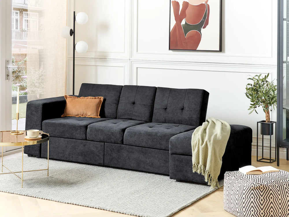 Sofa bed with black upholstery, ottoman storage, and drawers