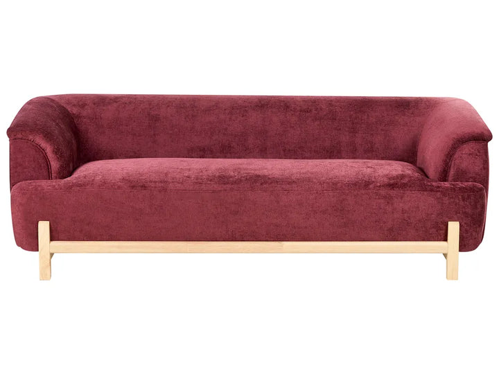 Red sofa with wooden legs on a white background