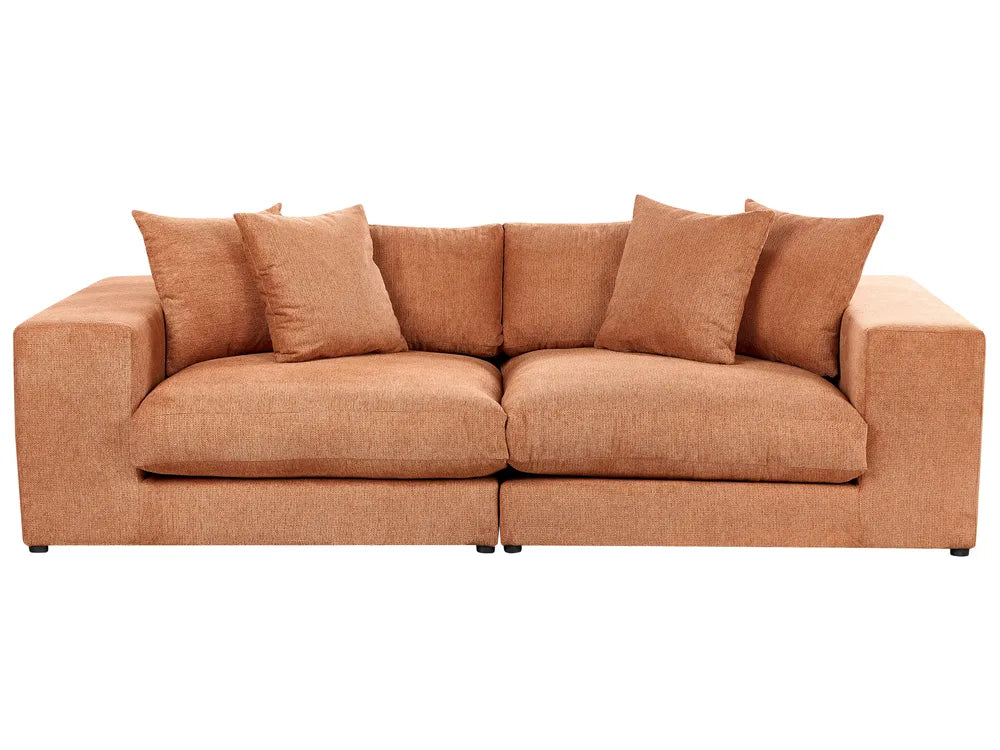 Brown sofa with cushions on a white background