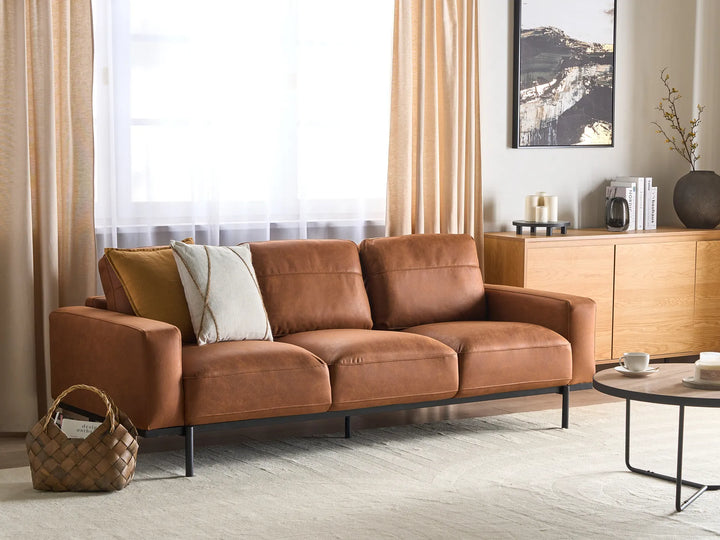 Brown faux leather three seater sofa for contemporary living rooms