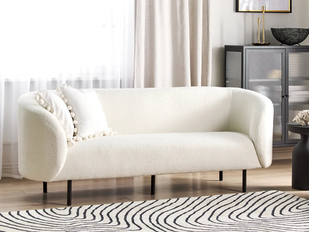 White bouclé three seater sofa with soft textured upholstery