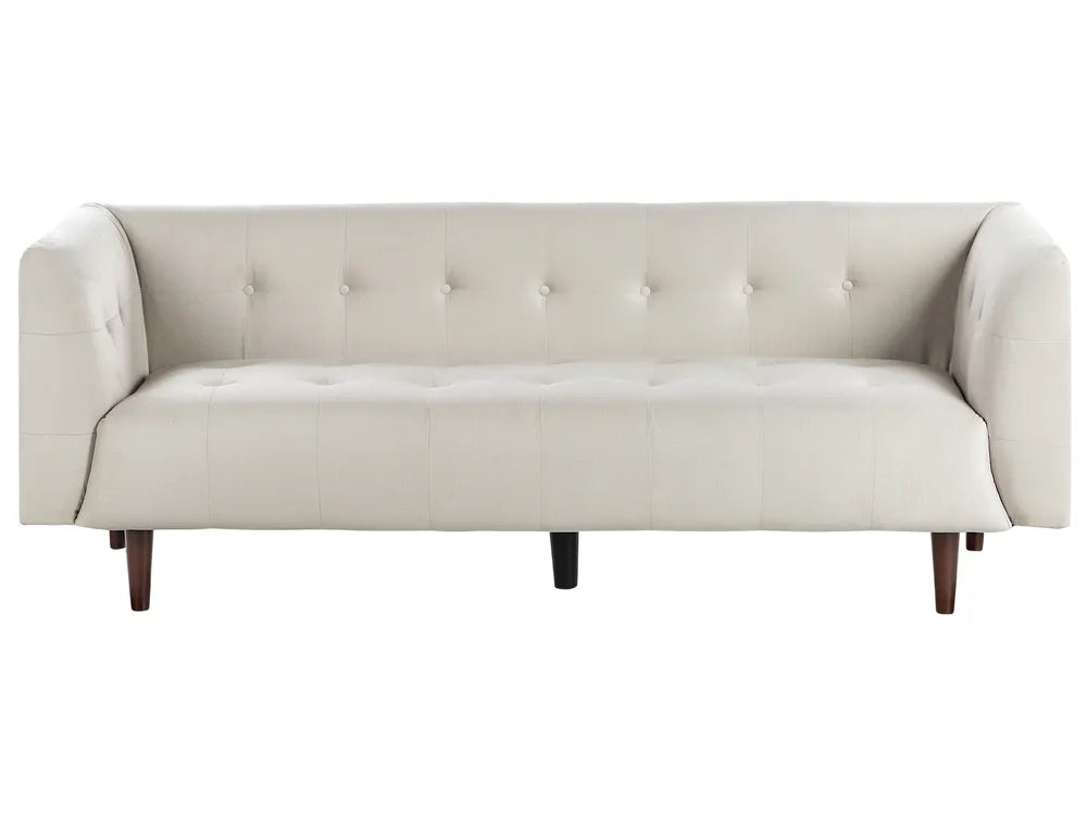 Beige sofa with buttoned backrest on a white background