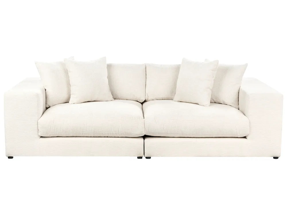 White sofa with cushions on a white background