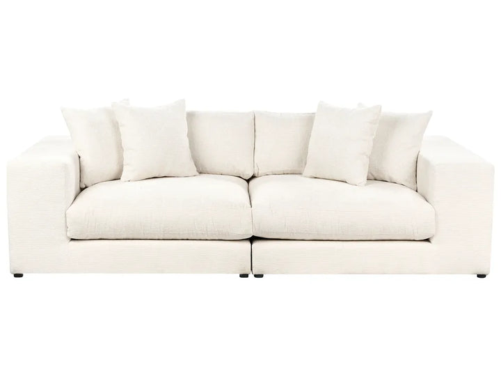 White sofa with cushions on a white background
