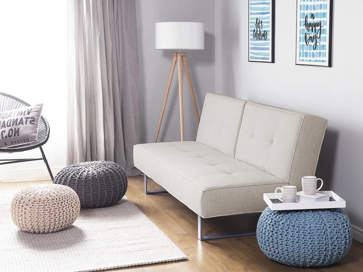 Comfortable 3-seater sofa bed in light beige fabric
