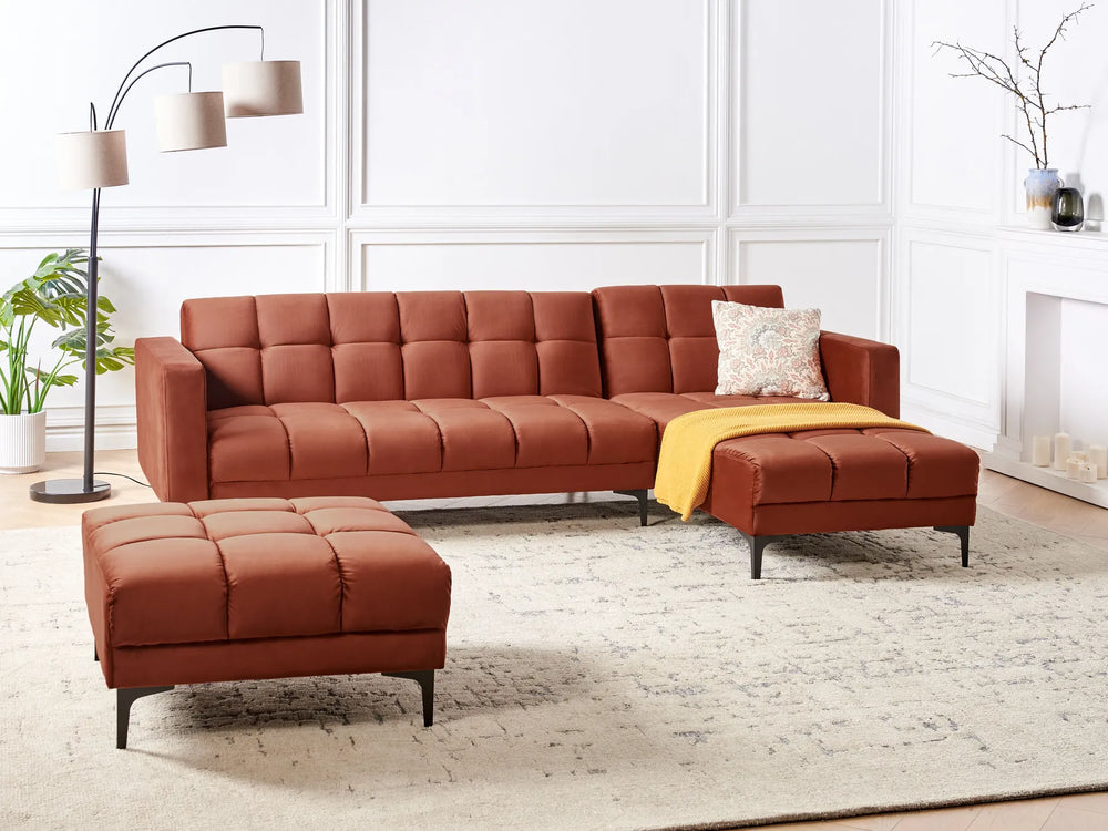 Brown sectional sofa with ottoman in a living room setting