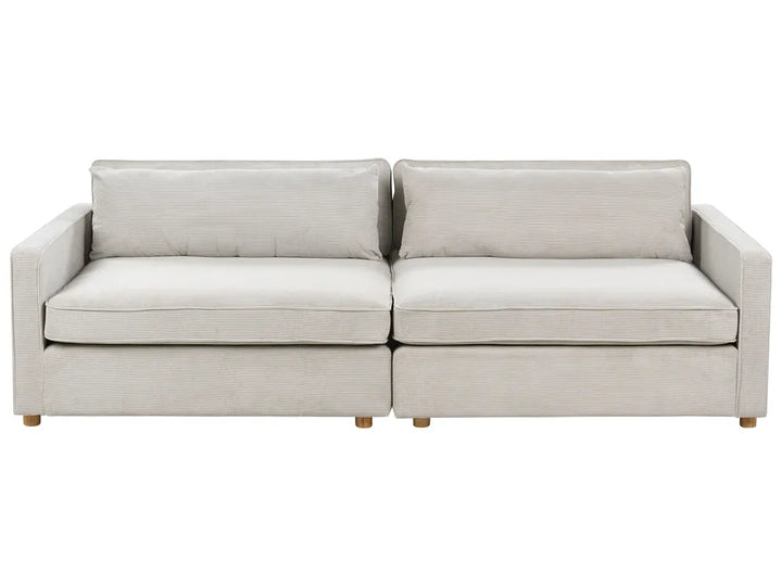Beige sectional sofa on a white background