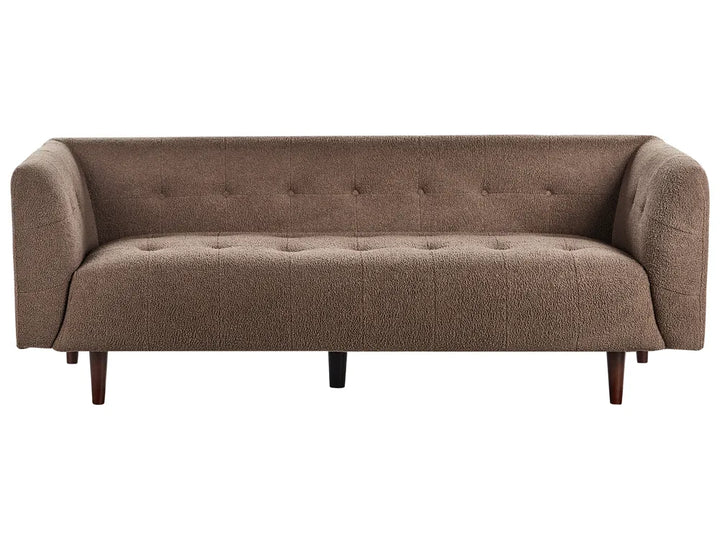 Brown sofa with tufted backrest on a white background
