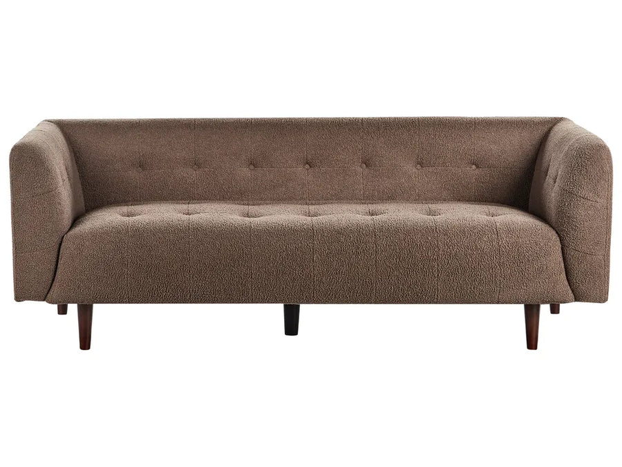 Brown sofa with tufted backrest on a white background