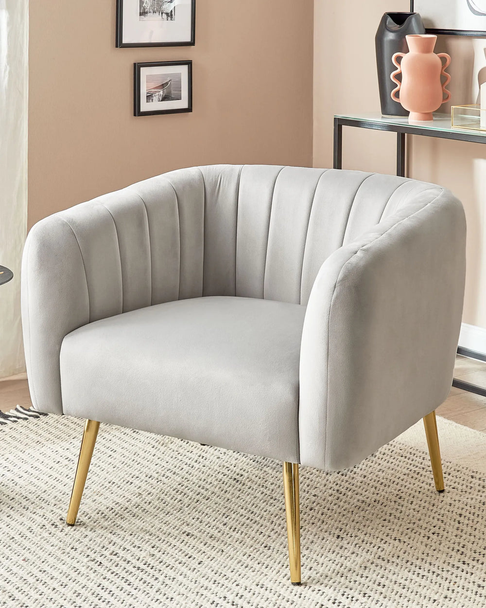Gray armchair with gold legs in a room setting
