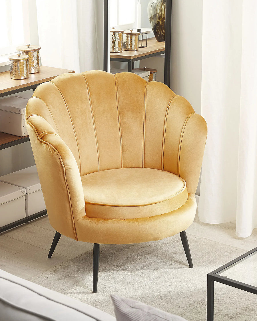 Yellow armchair in a room with a desk and decor items.