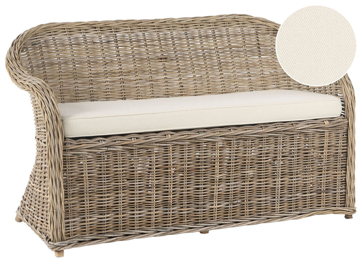Wicker outdoor loveseat with white cushion on a white background