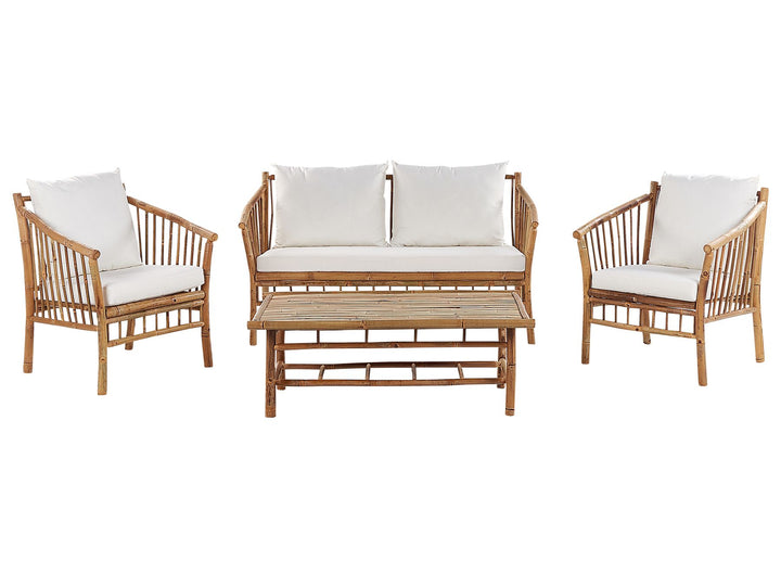 Rattan outdoor furniture set with white cushions on a white background