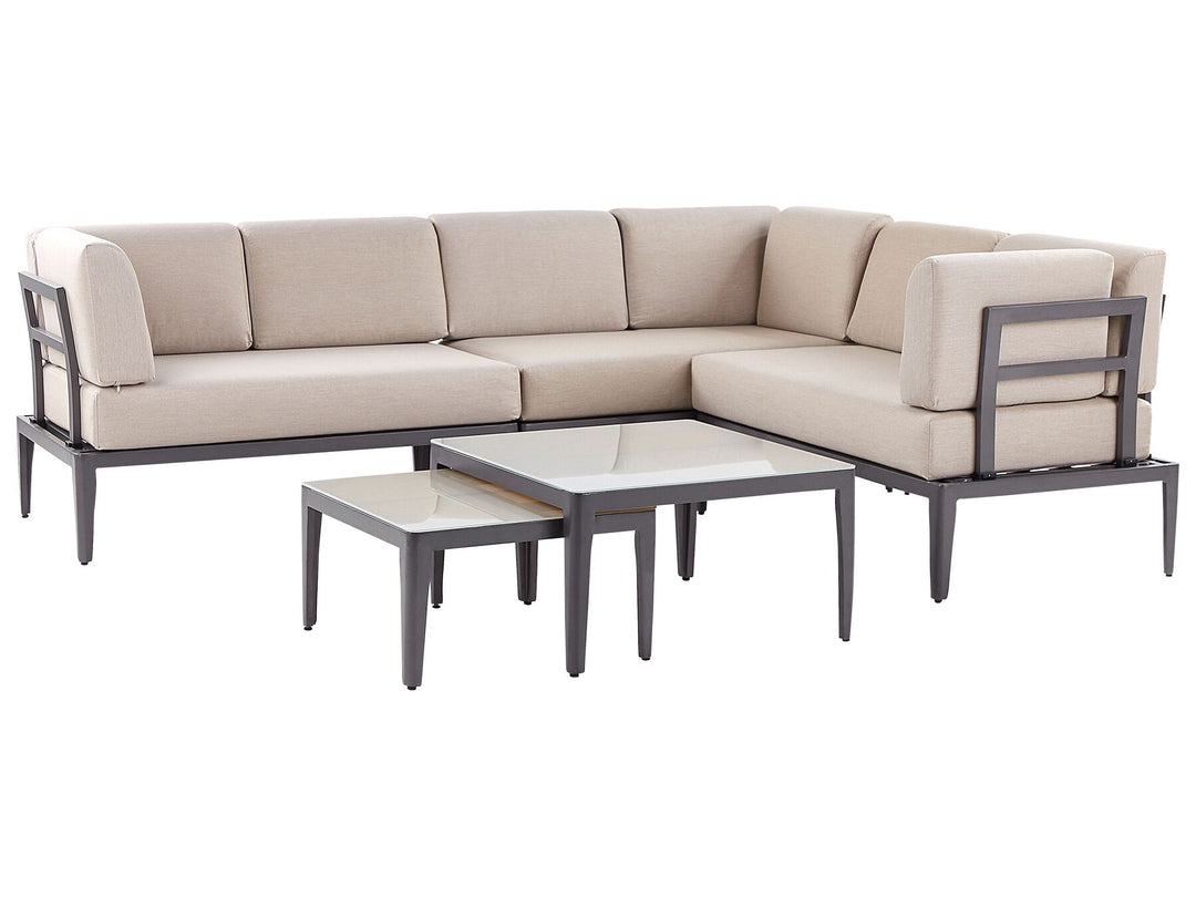 Beige sectional sofa with two coffee tables on a white background