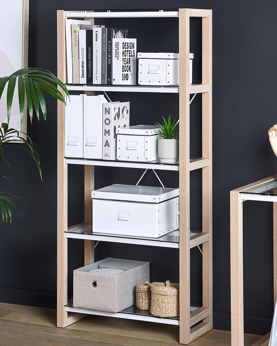 Wooden bookshelf with books, boxes, and decorative items against a dark wall.