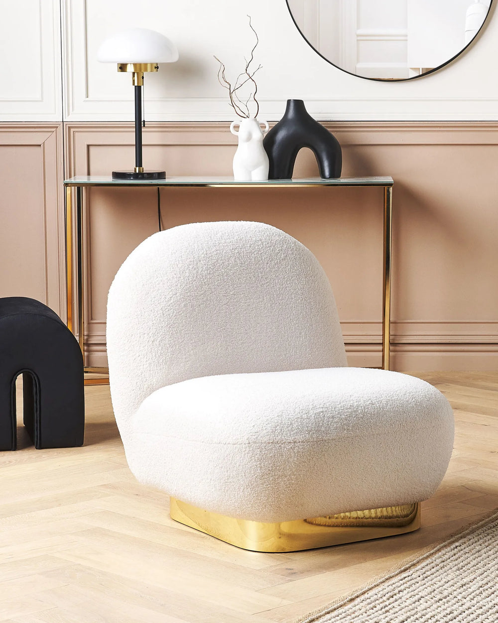 White textured chair with gold base in a stylish interior setting