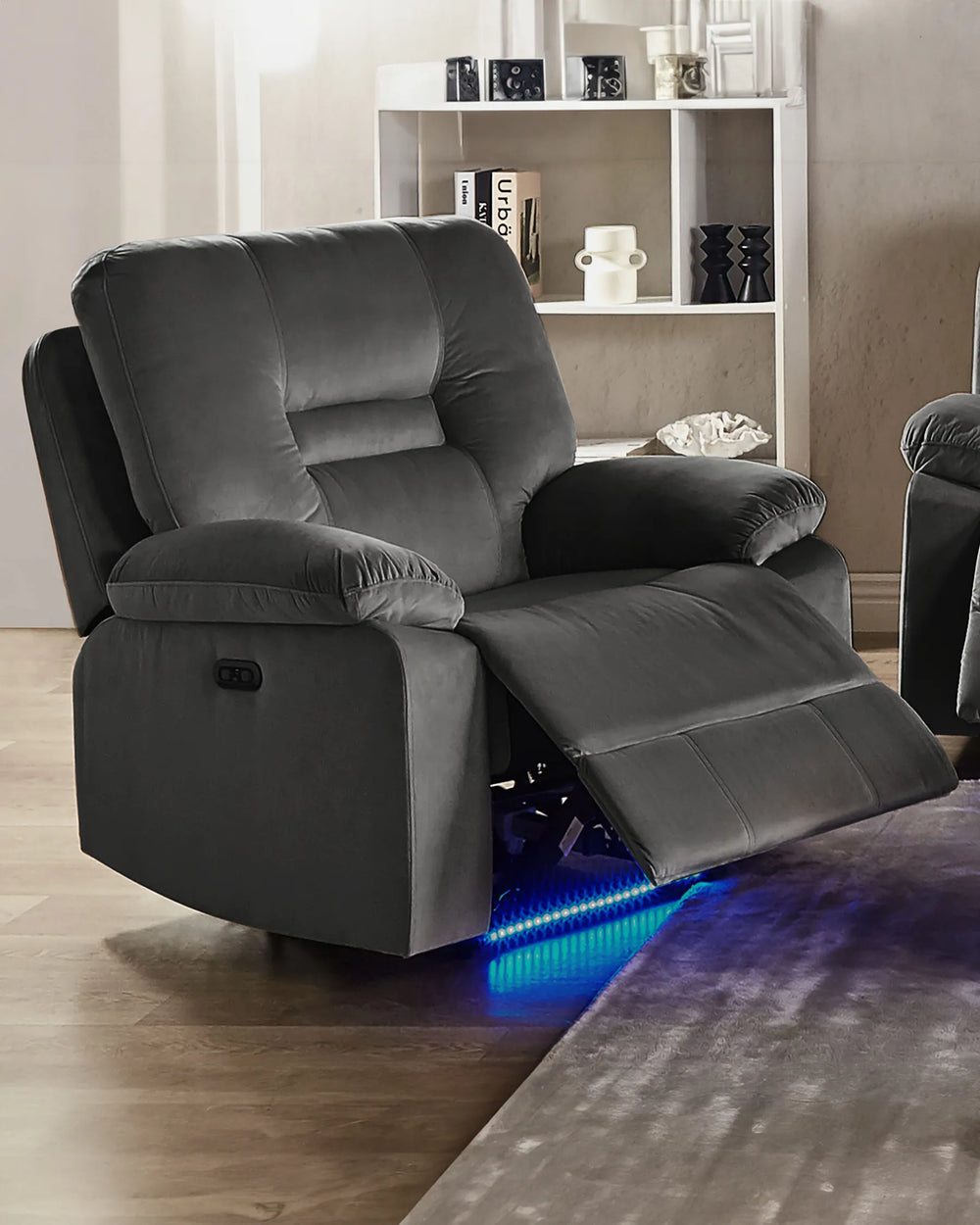 Gray recliner chair with LED lighting on a wooden floor.