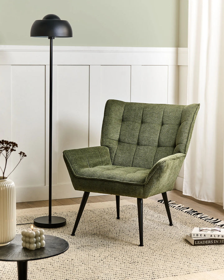 Combines robust craftsmanship with a refined green fabric upholstery.