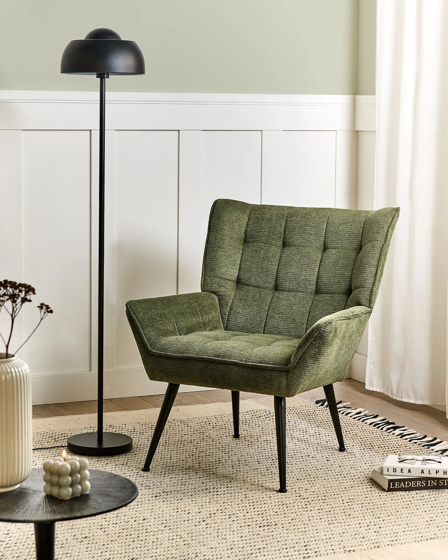 Combines robust craftsmanship with a refined green fabric upholstery.