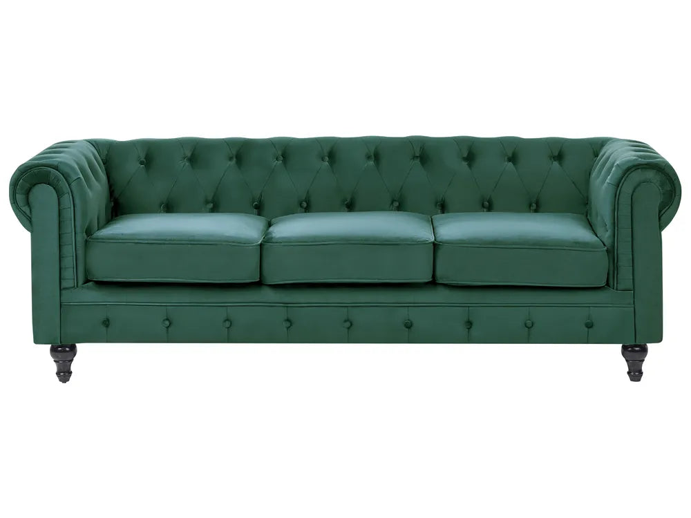 Green leather sofa with tufted backrest on a white background