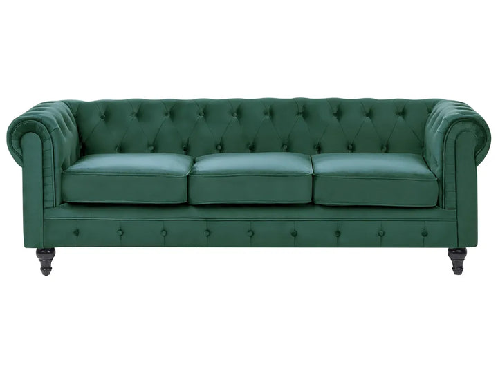 Green leather sofa with tufted backrest on a white background
