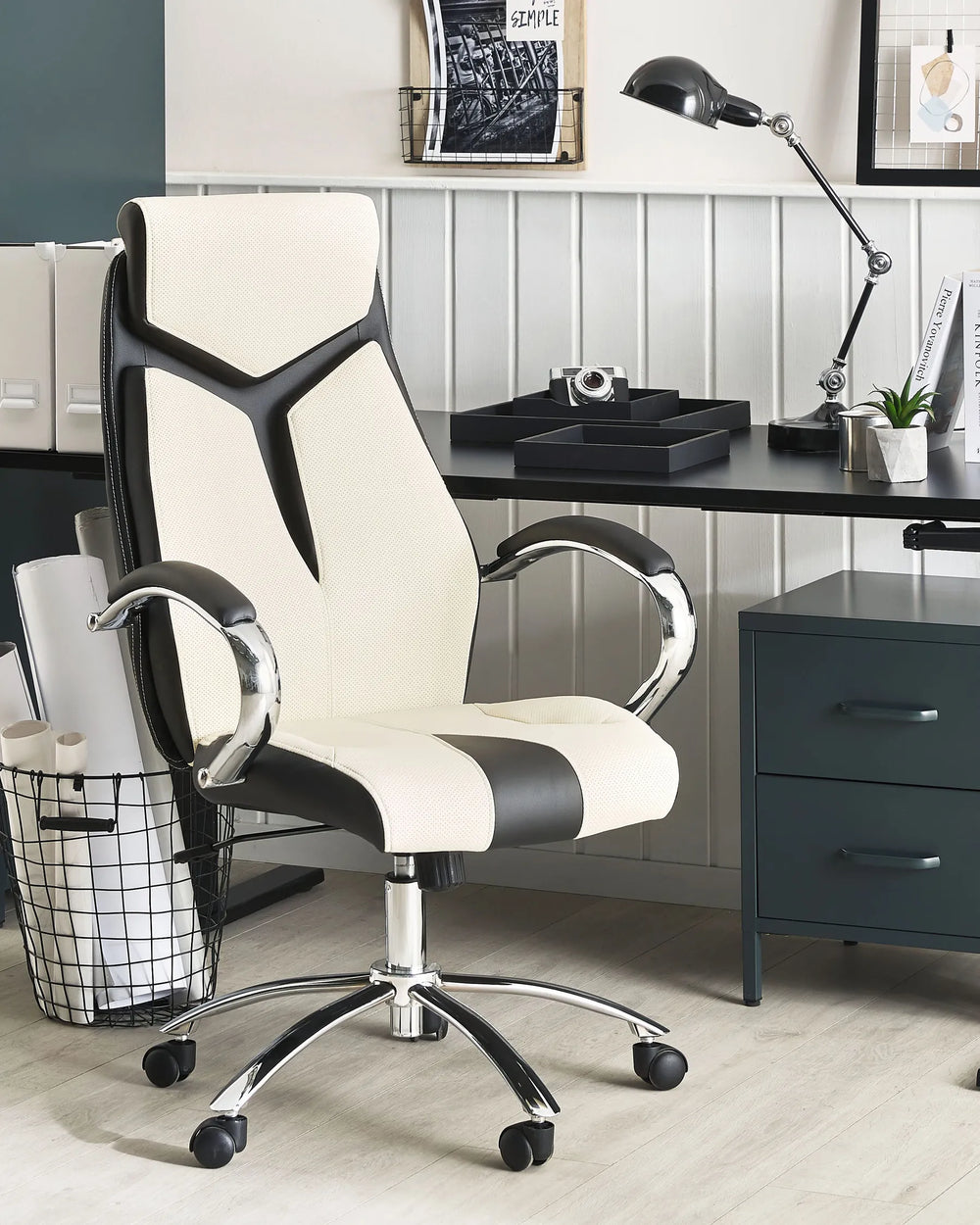 White and black office chair in a home office setting with a desk and decor.